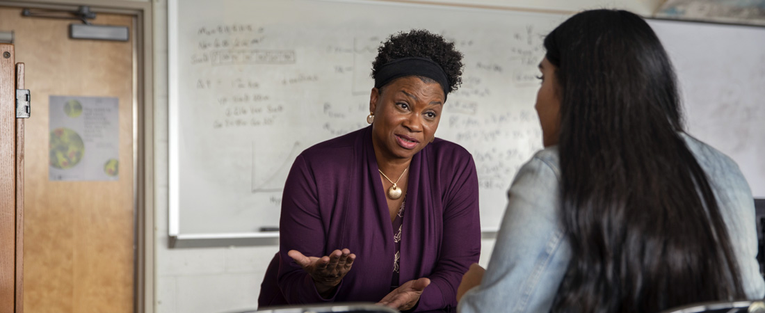 teacher talking to student