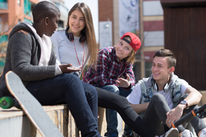 teens hanging out on school steps outside